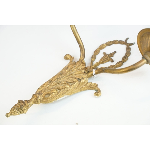 445 - Pair of gilt metal candle style wall sconces with two arms and ornate base with wreath detail, H 35c... 