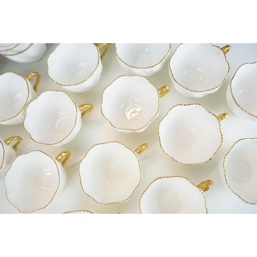 82A - Coalport white China cups and saucers with gold rim to include ten cups and sixteen saucers with ext... 