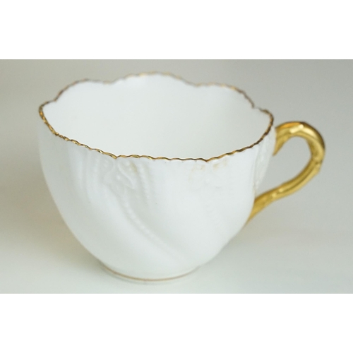 82A - Coalport white China cups and saucers with gold rim to include ten cups and sixteen saucers with ext... 