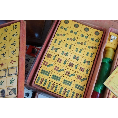 387 - Two boxed Mah Jong game sets, one 1923 version with Bakelite butterscotch tiles together with hand m... 