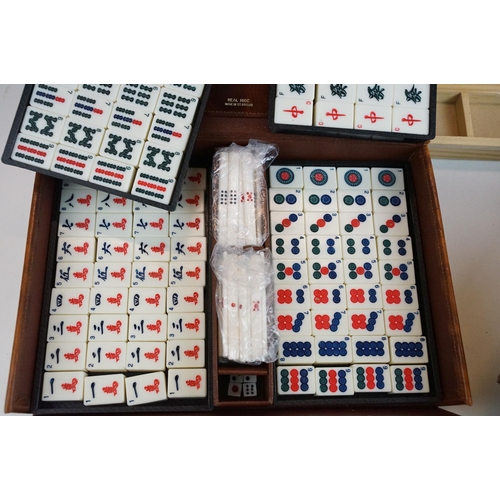 387 - Two boxed Mah Jong game sets, one 1923 version with Bakelite butterscotch tiles together with hand m... 