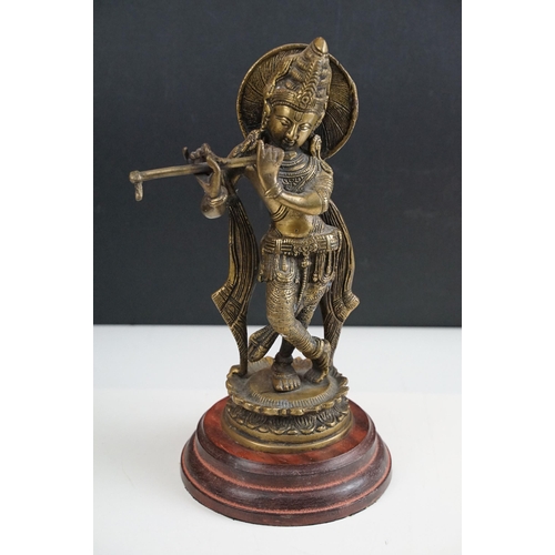 392 - Brass seated Buddha, H 17.5cm together with Krishna playing flute statue, H 30cm