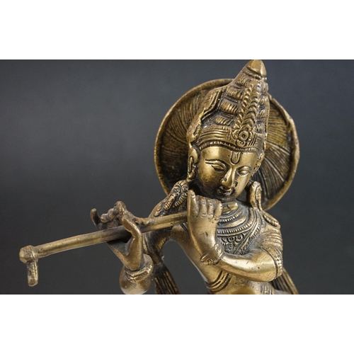 392 - Brass seated Buddha, H 17.5cm together with Krishna playing flute statue, H 30cm