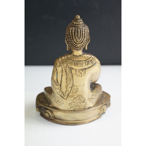 392 - Brass seated Buddha, H 17.5cm together with Krishna playing flute statue, H 30cm