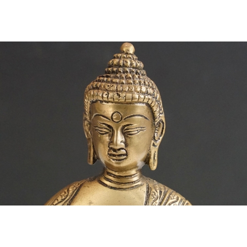 392 - Brass seated Buddha, H 17.5cm together with Krishna playing flute statue, H 30cm