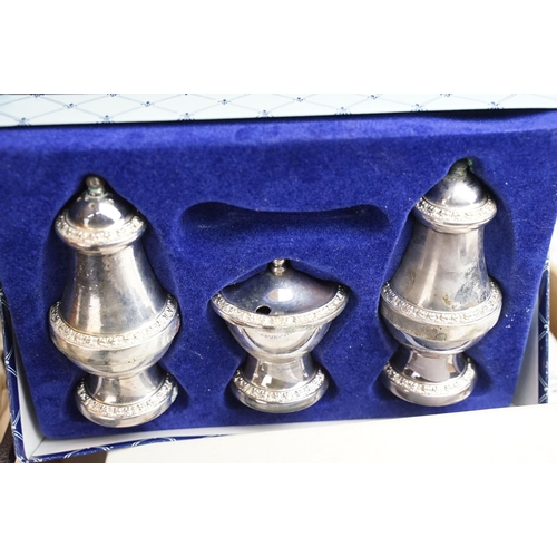 409 - Large collection of silver plated items to include cruet set, tray, coasters, serving cutlery, table... 