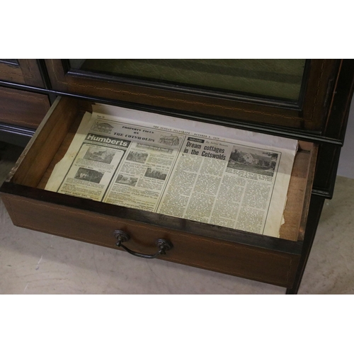 565 - Marquetry inlaid mahogany display cabinet with glazed doors and two short drawers, raised on square ... 