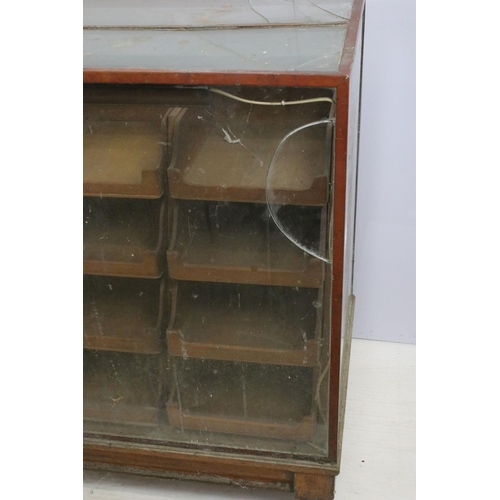 566 - Mid 20th century glass haberdashery framed display cabinet with twenty four drawers, H 91cm, W 183cm... 