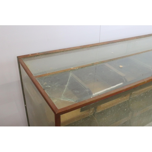 566 - Mid 20th century glass haberdashery framed display cabinet with twenty four drawers, H 91cm, W 183cm... 