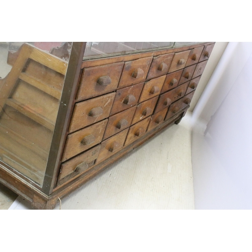 566 - Mid 20th century glass haberdashery framed display cabinet with twenty four drawers, H 91cm, W 183cm... 