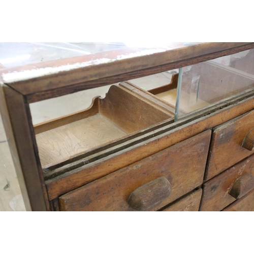 566 - Mid 20th century glass haberdashery framed display cabinet with twenty four drawers, H 91cm, W 183cm... 