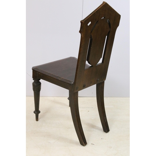 569 - Pair of Victorian oak hall chairs with moulded edge seat and carved back panel on turned legs, H 88c... 