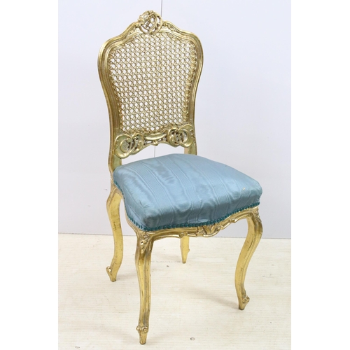 570 - Rococo French style gilded wood cane back bedroom chair with blue upholstery, H90cm together with a ... 