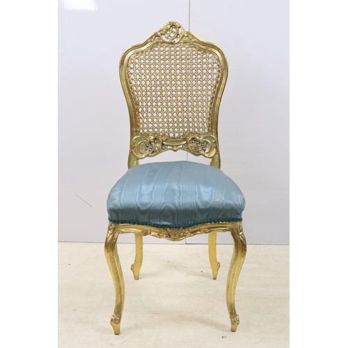 570 - Rococo French style gilded wood cane back bedroom chair with blue upholstery, H90cm together with a ... 