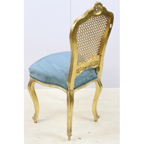 570 - Rococo French style gilded wood cane back bedroom chair with blue upholstery, H90cm together with a ... 