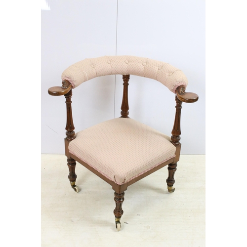 571 - Edwardian hard wood upholstered corner chair on turned legs with castors and button back detail, app... 