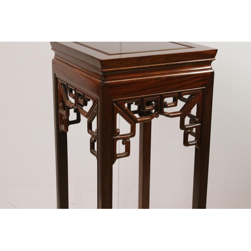 575 - Hardwood flower plant stand torcheres, one with square top and oriental carved decoration, one round... 