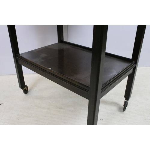 578 - Drop leaf side table with lower shelf, on square legs with castors, H 71cm, W 63cm D 36cm (not exten... 