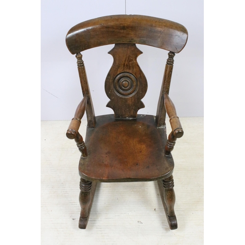 579 - Antique child's Windsor rocking chair, H 69cm