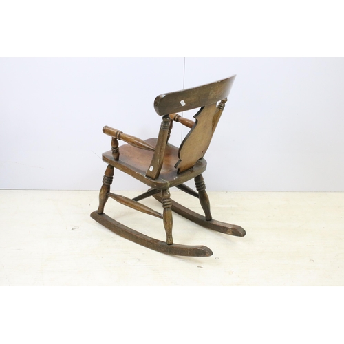 579 - Antique child's Windsor rocking chair, H 69cm