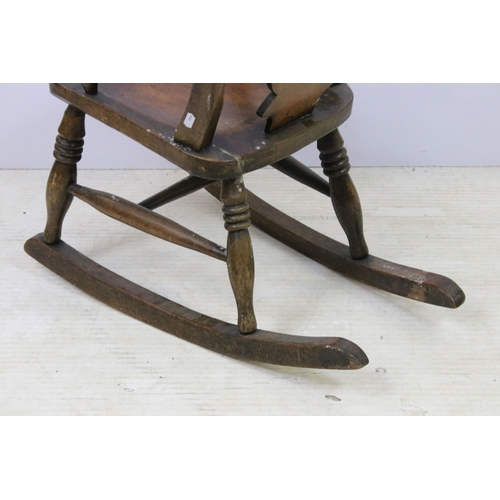 579 - Antique child's Windsor rocking chair, H 69cm