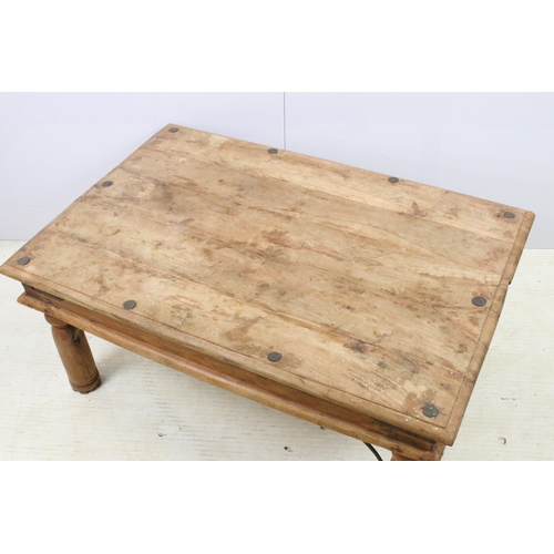 582 - Hard wood rectangular coffee table with turned legs, metal brackets and stud nail detail, H 39cm W 8... 