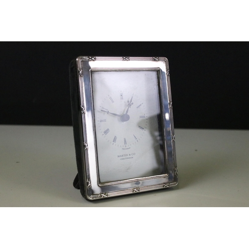 324 - Hallmarked silver Martin & Co, Cheltenham easel back clock, London 1991 by Gordon & Christopher Kitn... 