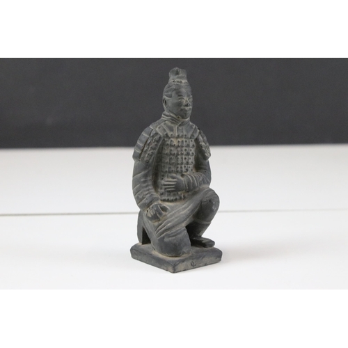 325 - Collection of black ceramic Chinese army figurines together with a cast brass Emporer figurine, moth... 