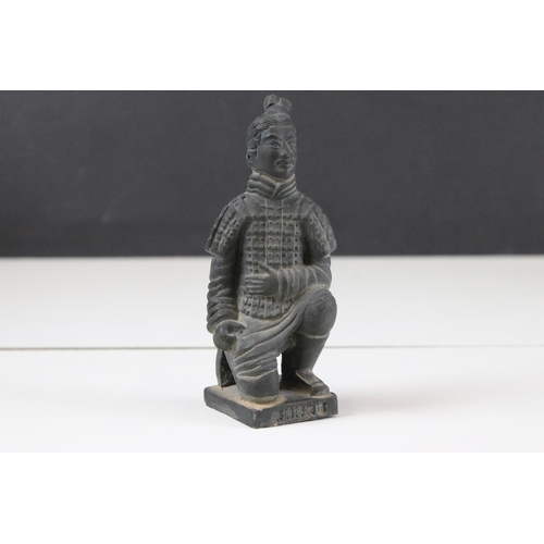 325 - Collection of black ceramic Chinese army figurines together with a cast brass Emporer figurine, moth... 