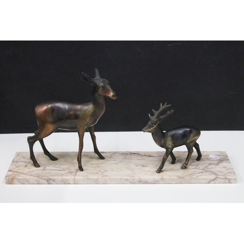 123 - Two Art Deco cast metal deer on marble base plinth, H 25cm, W 50cm, D12cm