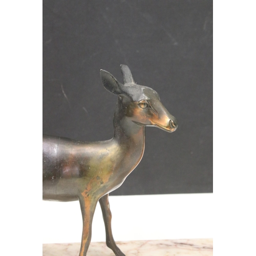 123 - Two Art Deco cast metal deer on marble base plinth, H 25cm, W 50cm, D12cm