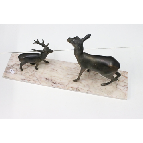 123 - Two Art Deco cast metal deer on marble base plinth, H 25cm, W 50cm, D12cm