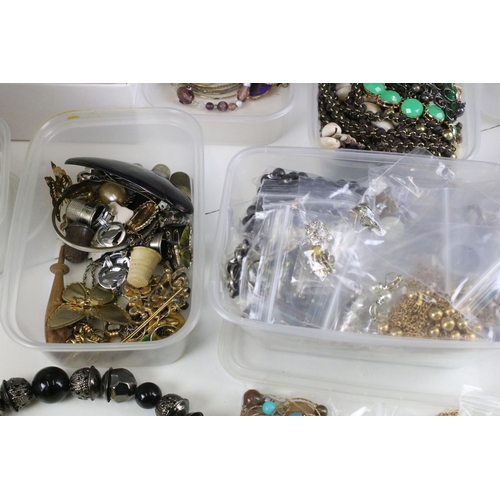 291 - Mixed assortment of costume jewellery items to include two jewellery stands in the form of women, be... 