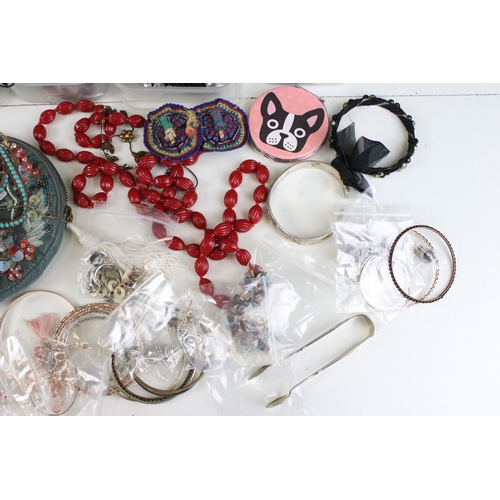 295 - Large collection of costume jewellery to include silver plate spoons. vintage badges, beaded necklac... 