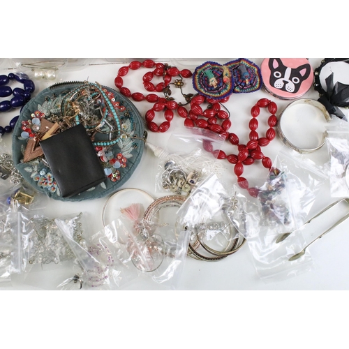 295 - Large collection of costume jewellery to include silver plate spoons. vintage badges, beaded necklac... 