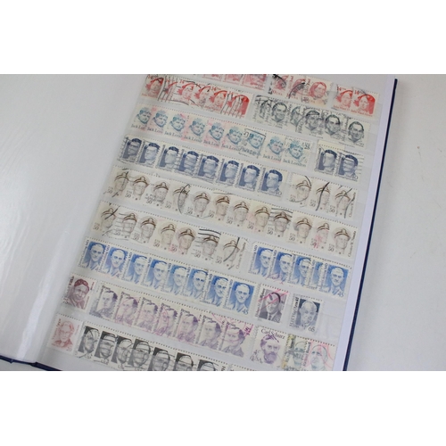 375 - Collection of stamps presented across 14 albums to include mostly 20th Century world franked stamps,... 