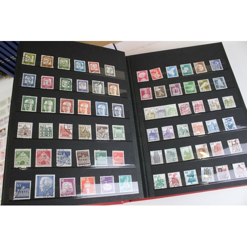 375 - Collection of stamps presented across 14 albums to include mostly 20th Century world franked stamps,... 