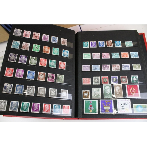 375 - Collection of stamps presented across 14 albums to include mostly 20th Century world franked stamps,... 