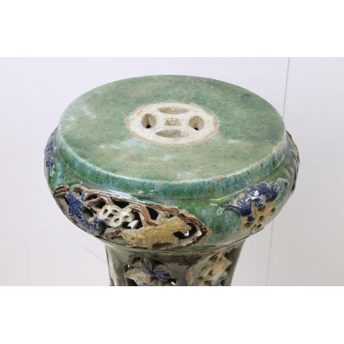 450 - Chinese glazed stoneware jardiniere stand with openwork decoration on hexagonal base with circular t... 