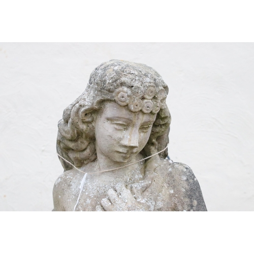 538 - Reconstituted stone statue of girl in robe with flowers, approx. H 134cm