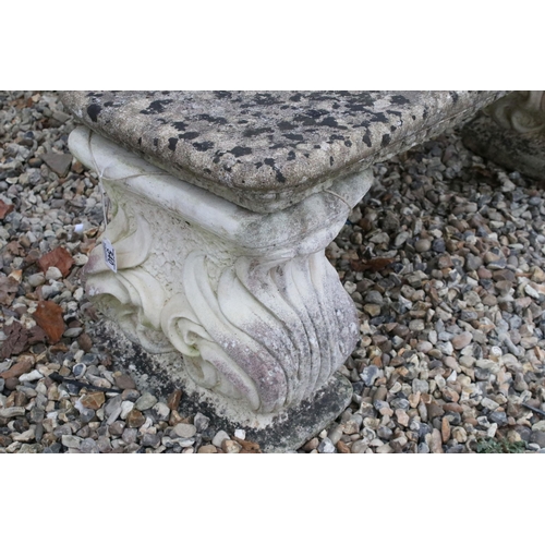 540 - Reconstituted stone bench with scroll base H 41cm, W 124cm, D 38cm