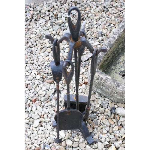 541 - Wrought iron fireside set with brush, shovel, tongs and poker