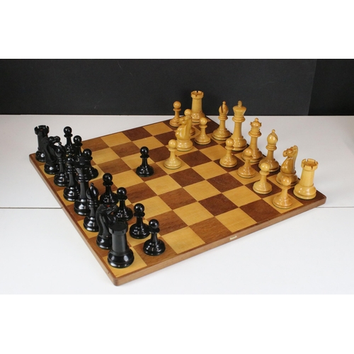 180 - A vintage Staunton chess set within wooden box together with wooden chess board. king stands approx ... 