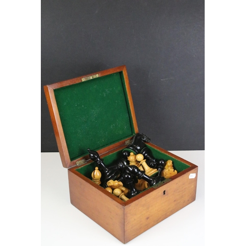 180 - A vintage Staunton chess set within wooden box together with wooden chess board. king stands approx ... 