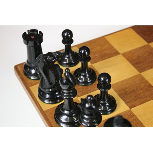 180 - A vintage Staunton chess set within wooden box together with wooden chess board. king stands approx ... 