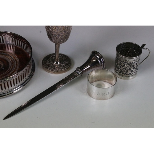 327 - Indian silver white metal goblet and drink measure cup, together with a silver plated wine coaster, ... 