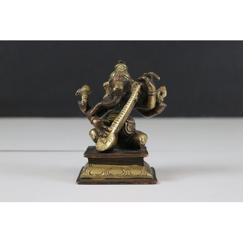 331 - Set of six Indian cast brass Ganesha figurines modelled playing instruments raised on square plinth ... 