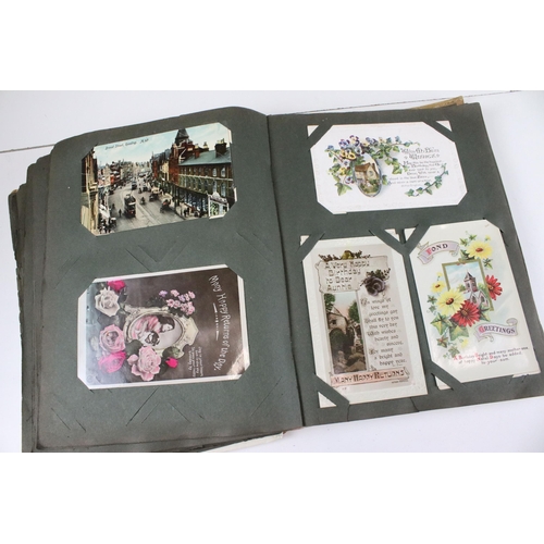 332 - Early 20th century postcard album and postcards to include Christmas, birthday, religious, hand sewn... 