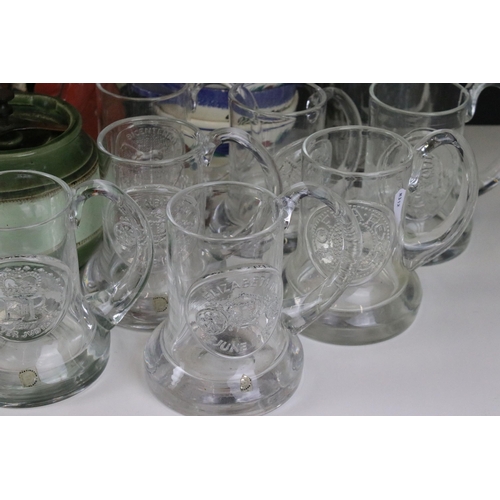 87 - Large collection of commemorative flat bottom glass tankard mugs to include Dartington crystal examp... 