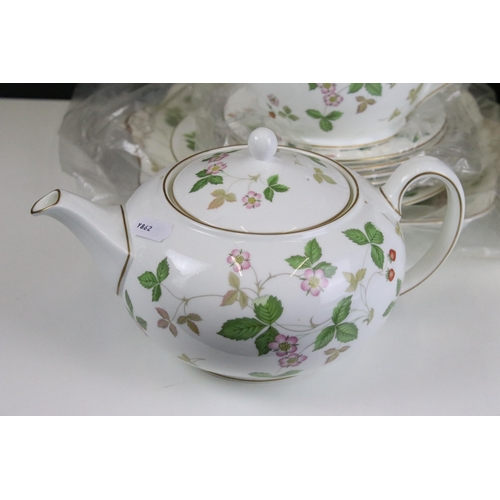 89 - Wedgwood 'Wild Strawberry' tea service set to include teapot, smaller tea pot, jug, six tea cups and... 